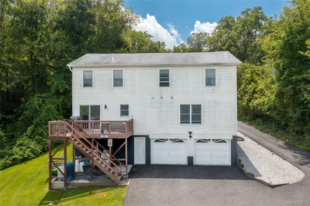a view of a terrace with a table and chairs