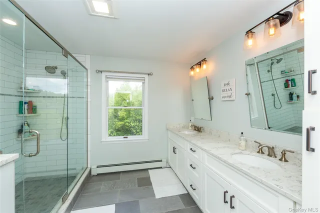 a bathroom with a shower and toilet
