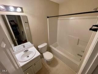 2112 Walnut Bluffs Lane Raleigh, NC 27610 - Photo 16 of 18 a bathroom with a sink a toilet and shower