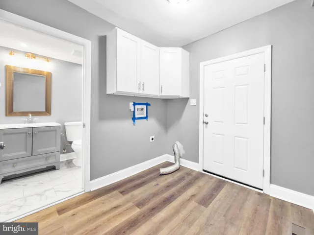 a view of a kitchen with wooden floor