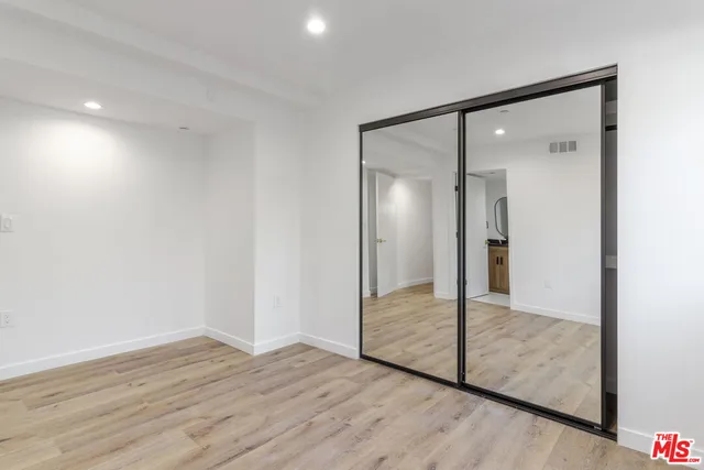 a view of wooden floor in an empty room