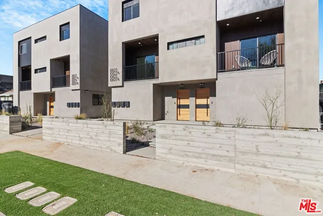 a outdoor space with patio furniture and flat screen tv