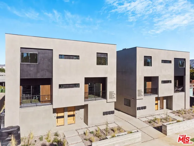 an aerial view of a city with lots of residential buildings