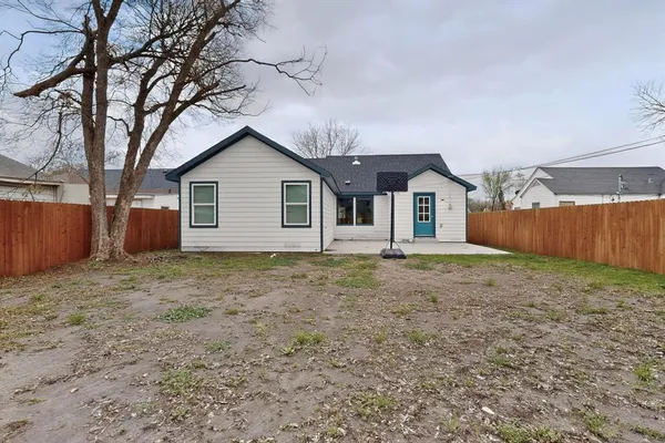 a house with trees in the background