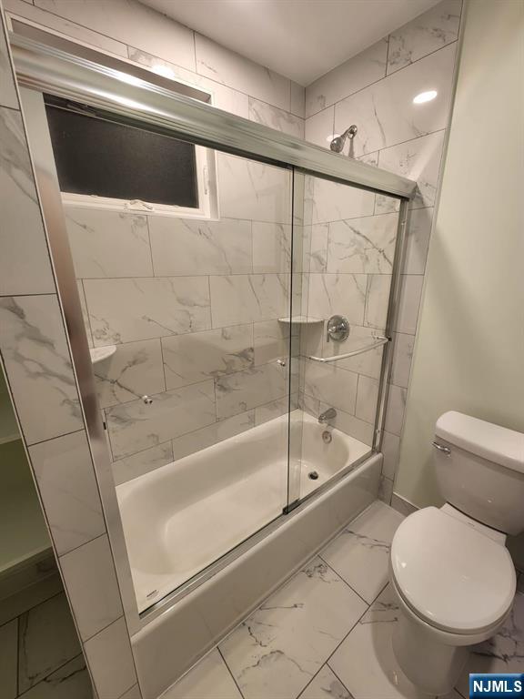229 East 24th Street, Unit 1 Paterson, NJ 07514 - Photo 11 of 19 a bathroom with a toilet and a shower
