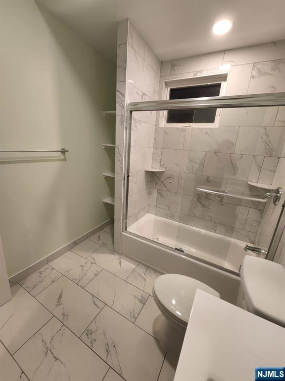 229 East 24th Street, Unit 1 Paterson, NJ 07514 - Photo 13 of 19 a bathroom with a bathtub and toilet