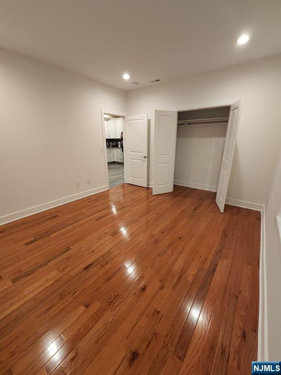 229 East 24th Street, Unit 1 Paterson, NJ 07514 - Photo 4 of 19 a view of empty room with wooden floor