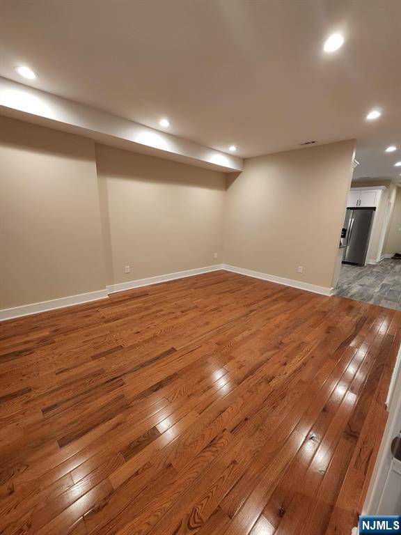 229 East 24th Street, Unit 1 Paterson, NJ 07514 - Photo 7 of 19 a view of empty room with wooden floor