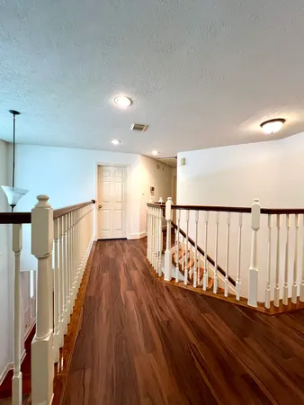 a view of entryway with wooden floor