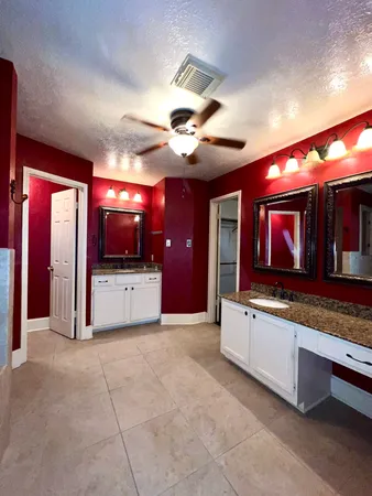 a kitchen with stainless steel appliances granite countertop a sink and a microwave