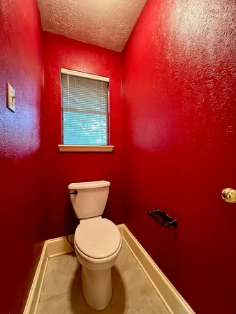 a bathroom with a toilet and a sink