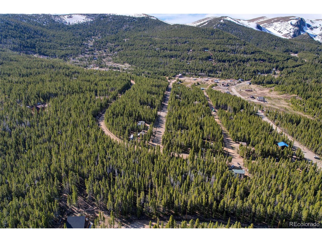 171 Lower Forest Road Idaho Springs, CO 80452 - Photo 5 of 30 a view of a lush green hillside and houses