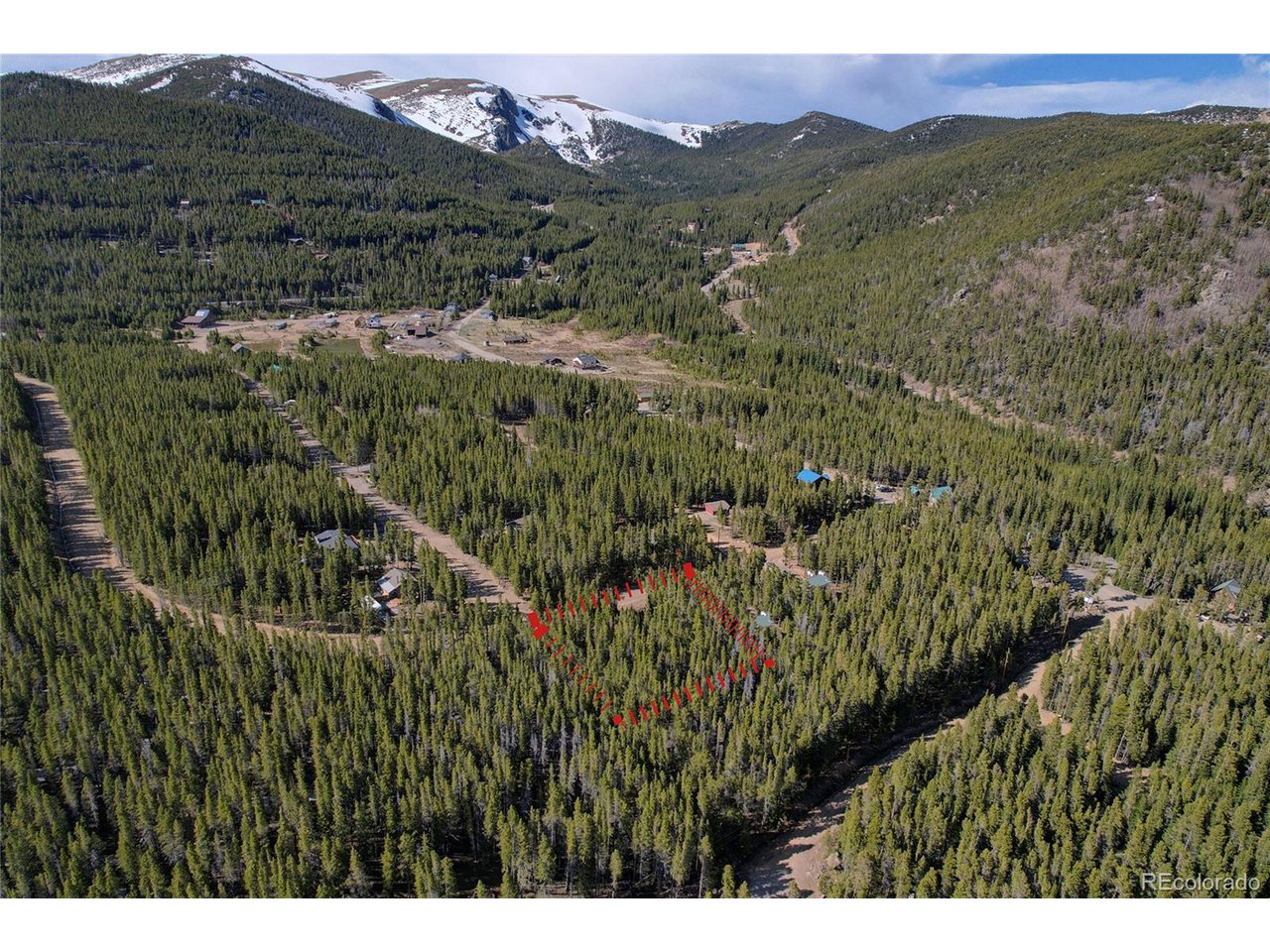 171 Lower Forest Road Idaho Springs, CO 80452 - Photo 6 of 30 a view of a lush green hillside and a mountain