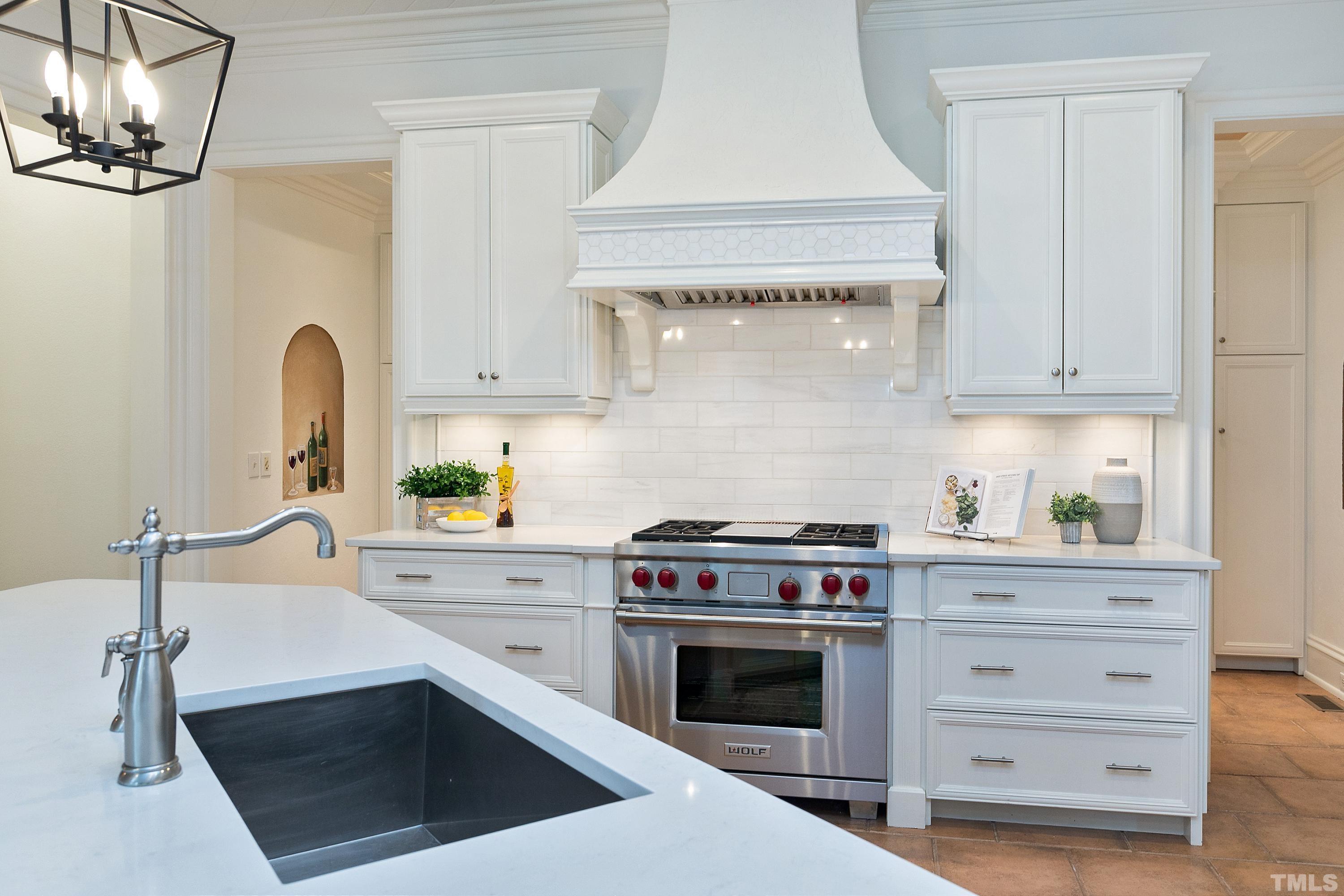 3725 Rolston Drive Raleigh, NC 27609 - Photo 4 of 6 This large kitchen boasts EXTRA LARGE ISLAND complete with QUARTZ TOP! Open to the Family Room and breakfast area. High End Wolf/SubZero/Miele appliances!