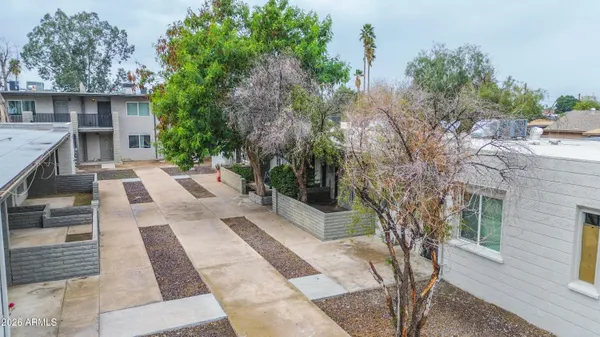 a view of a backyard with sitting area