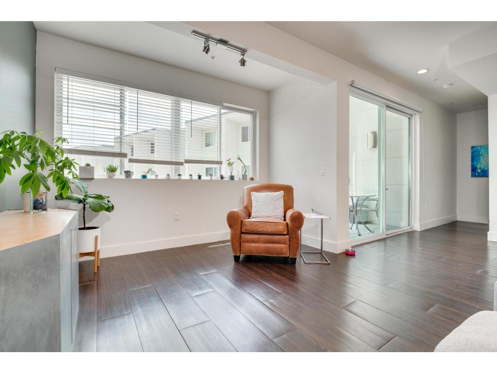 604 North Bluff Drive, Unit 125 Austin, TX 78745 - Photo 11 of 28 a living room with furniture and a wooden floor