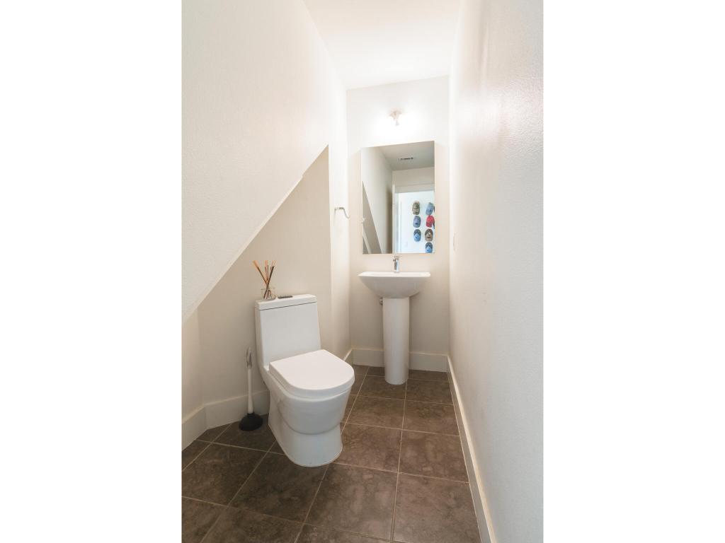604 North Bluff Drive, Unit 125 Austin, TX 78745 - Photo 18 of 28 a bathroom with a toilet and a sink