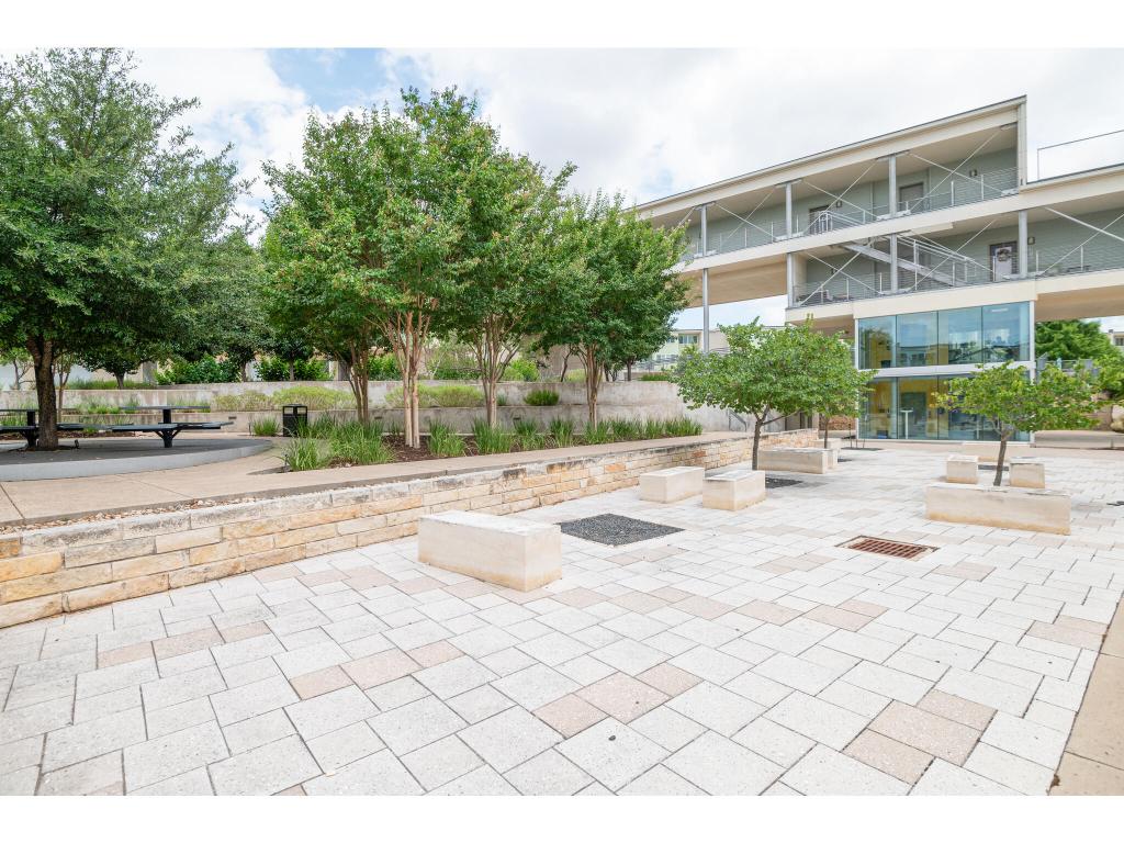 604 North Bluff Drive, Unit 125 Austin, TX 78745 - Photo 19 of 28 a view of a swimming pool with a lounge chair