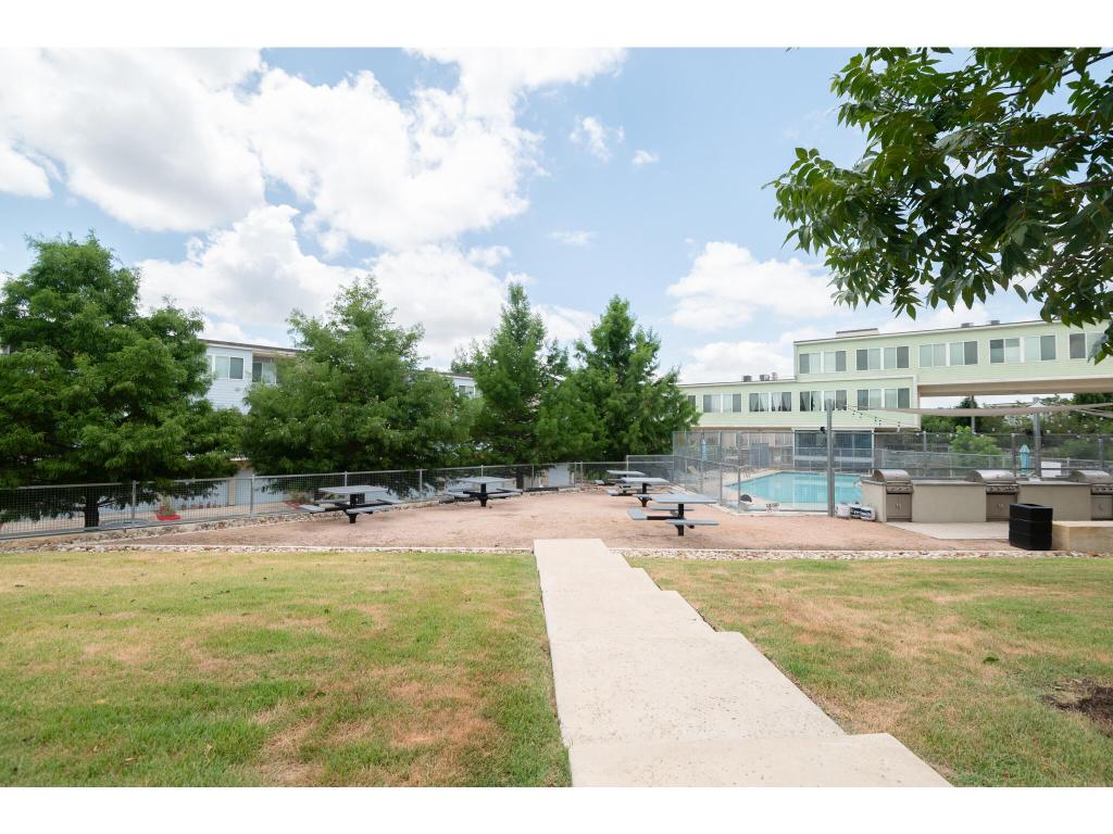 604 North Bluff Drive, Unit 125 Austin, TX 78745 - Photo 20 of 28 a swimming pool with outdoor seating and yard in the back