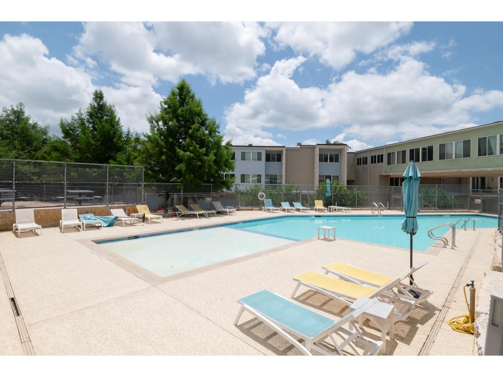 604 North Bluff Drive, Unit 125 Austin, TX 78745 - Photo 25 of 28 a view of a patio with a table and chairs