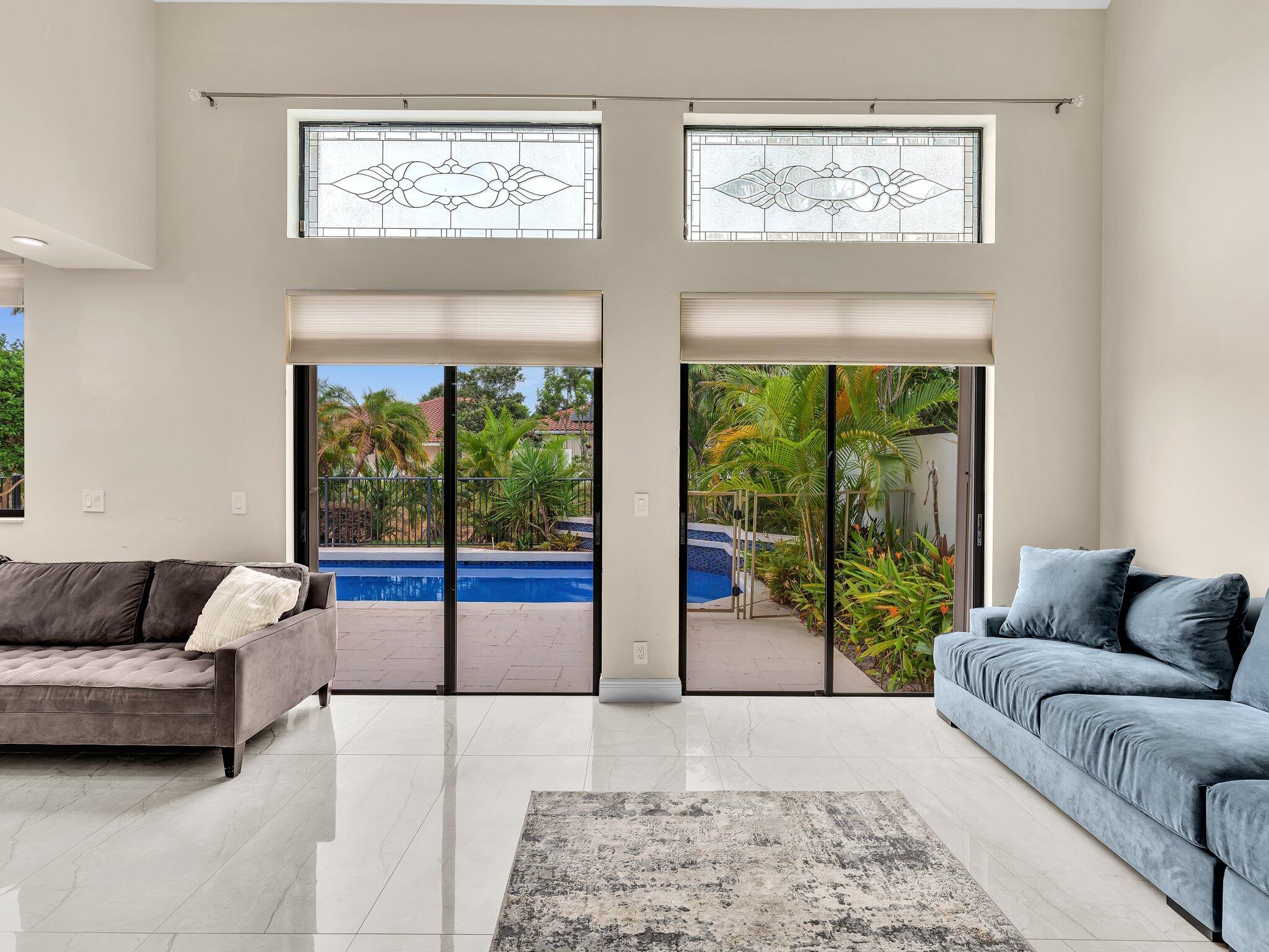 6400 Via Rosa Boca Raton, FL 33433 - Photo 23 of 81 a living room with furniture and a large window