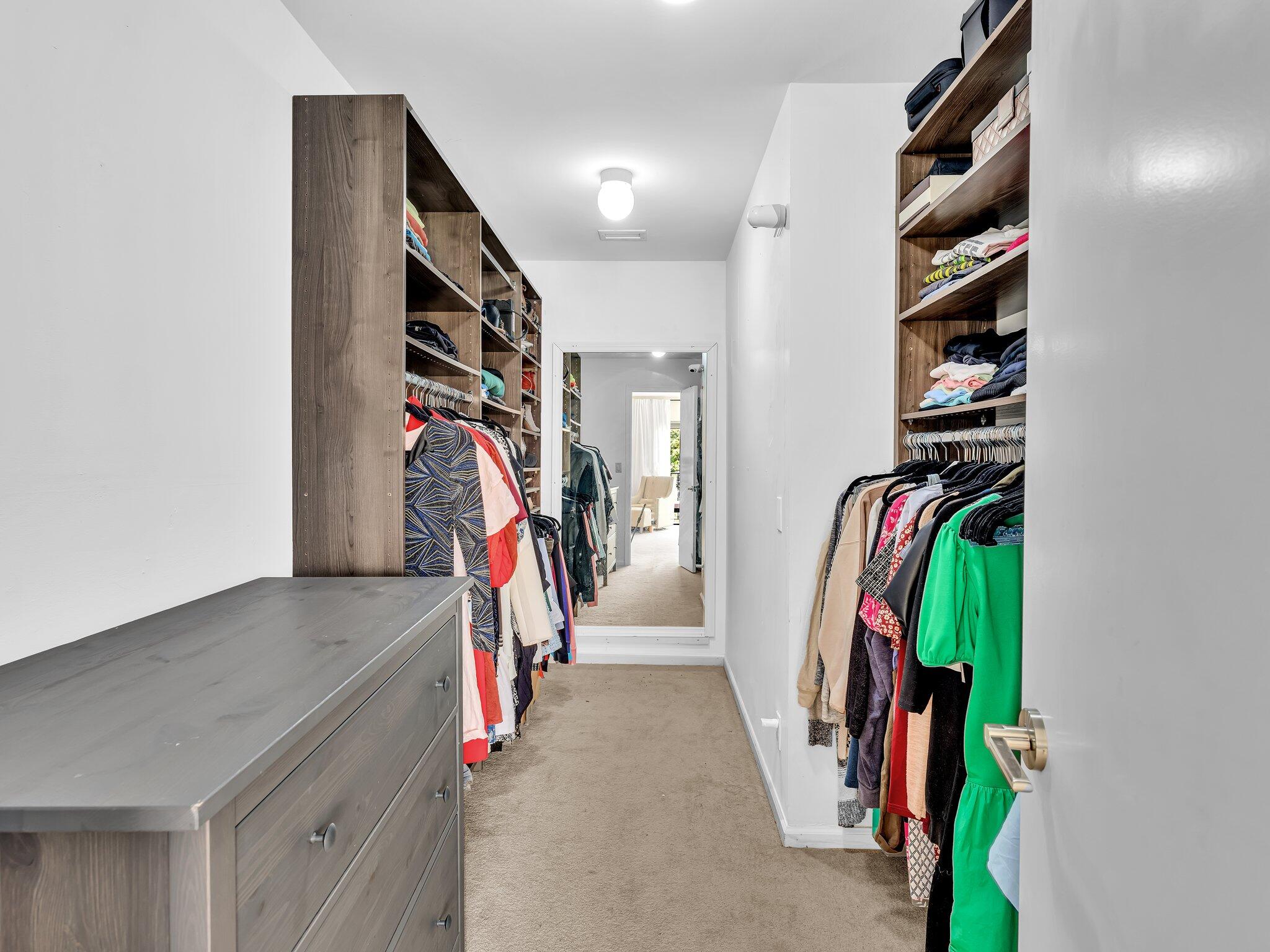 6400 Via Rosa Boca Raton, FL 33433 - Photo 43 of 81 a view of walk in closet with clothes and shoes