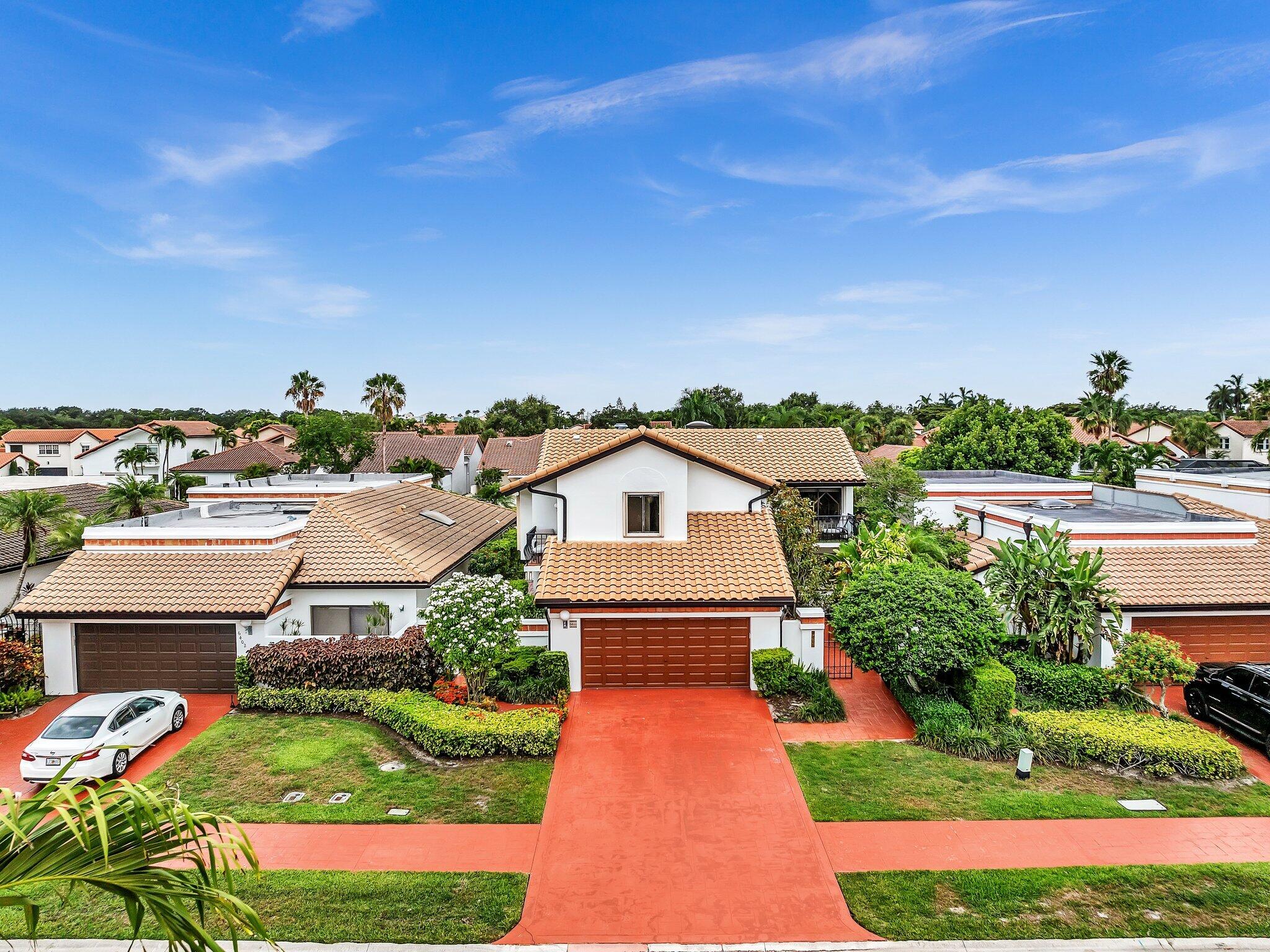 6400 Via Rosa Boca Raton, FL 33433 - Photo 58 of 81 a front view of a house with a yard