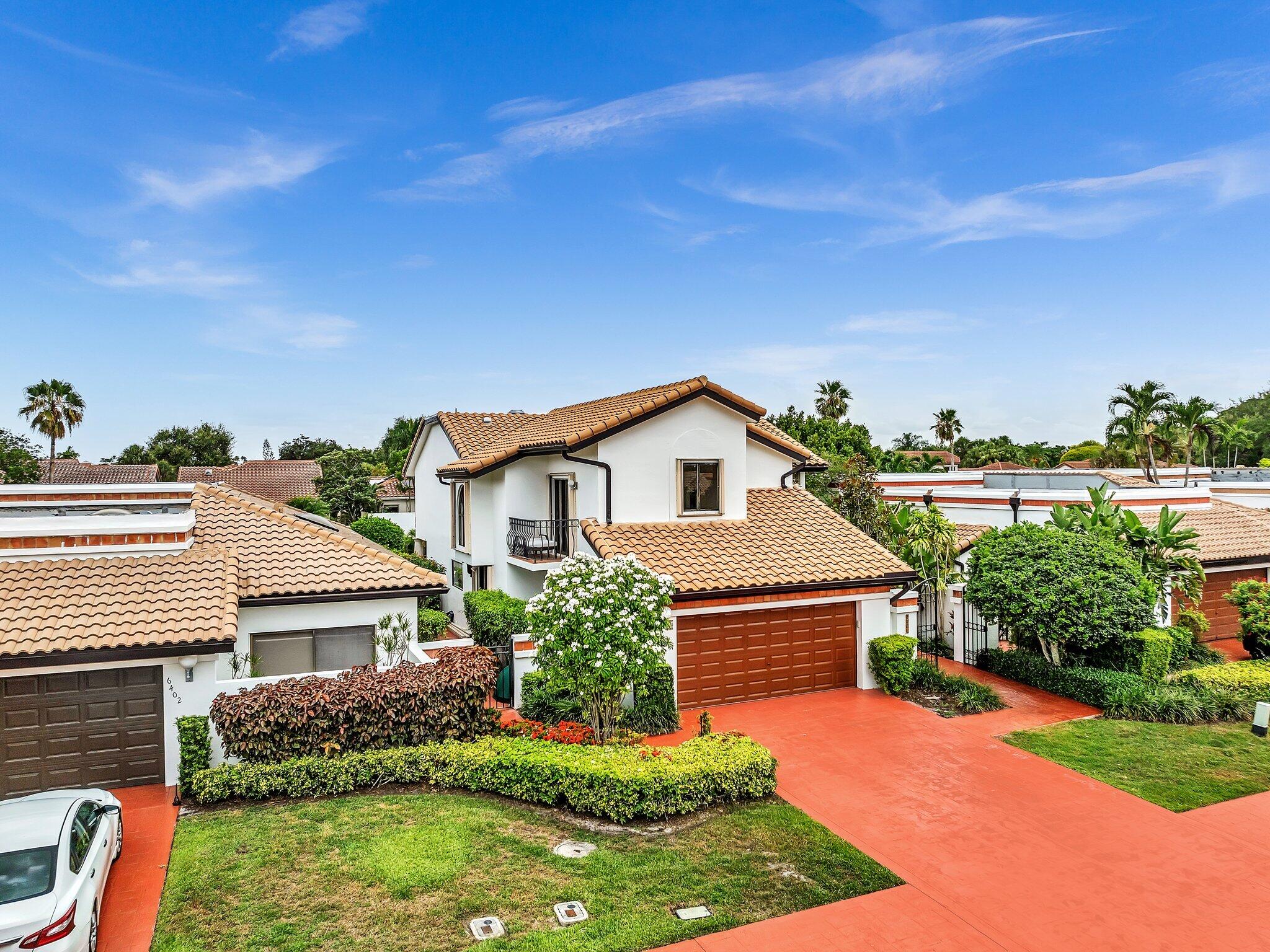 6400 Via Rosa Boca Raton, FL 33433 - Photo 59 of 81 front view of house with a yard