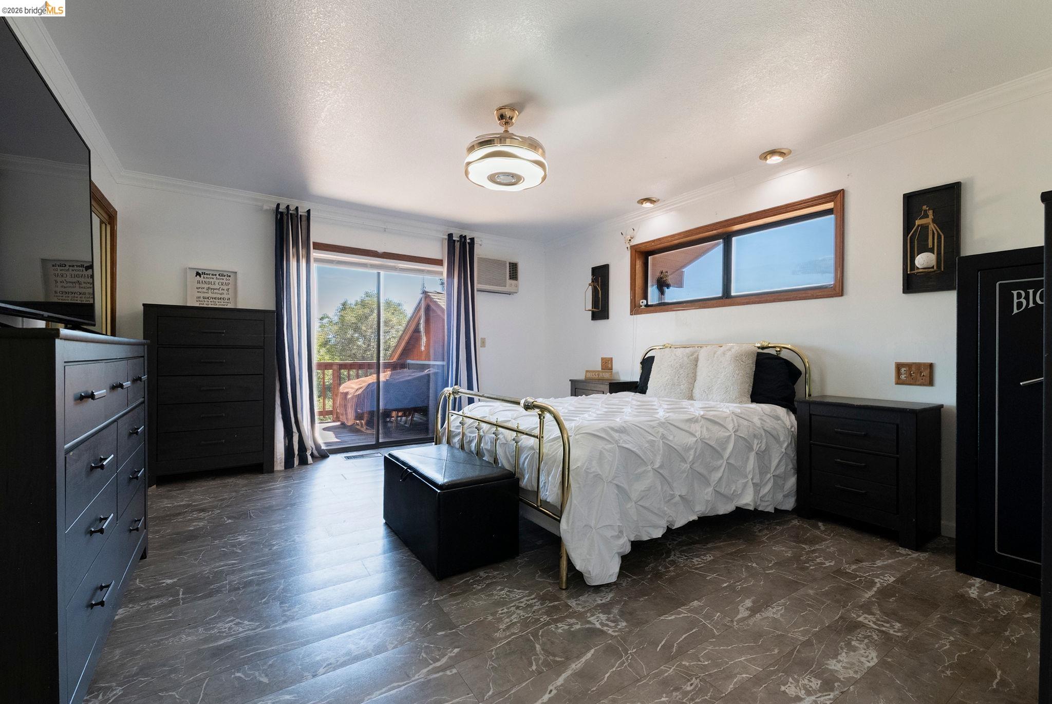 22963 Robertson Ranch Road Sonora, CA 95370 - Photo 21 of 90 Spacious room featuring wood-finish flooring, a ceiling fan with integrated lighting, recessed lighting, and a sliding glass door providing exterior access