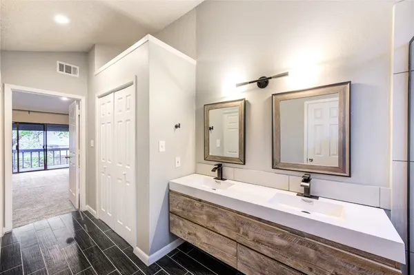 a bathroom with a shower and a sink