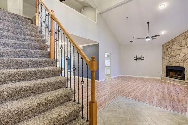 a view of entryway and hall with wooden floor