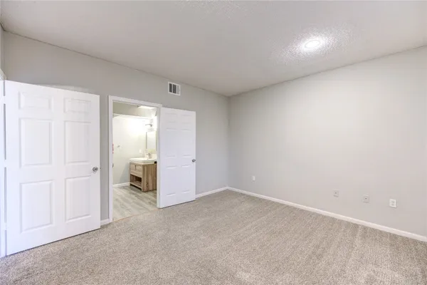 an empty room with a bathroom