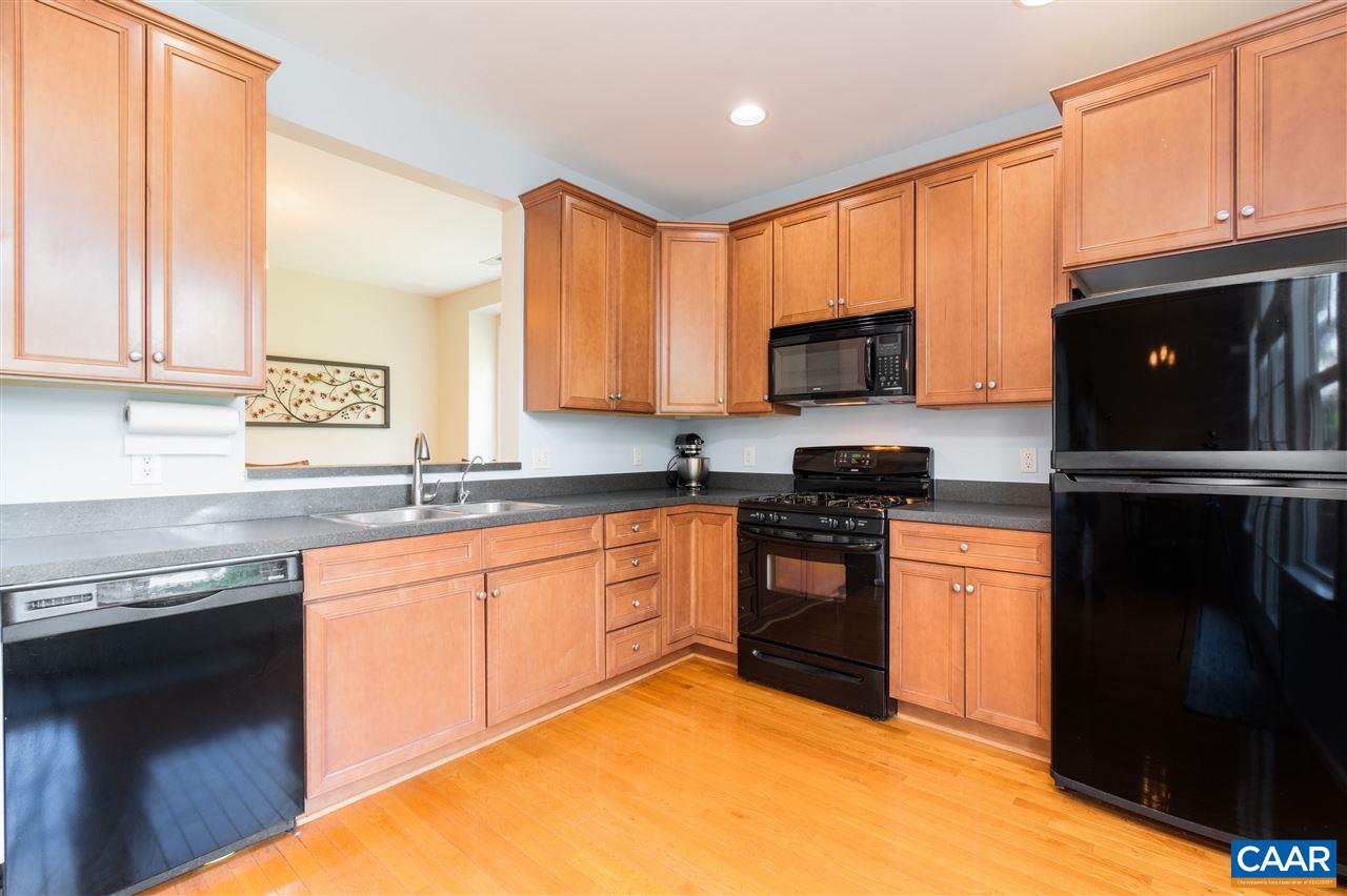 1313 Stoney Ridge Road Charlottesville, VA 22902 - Photo 13 of 38 a kitchen with granite countertop a refrigerator stove top oven a sink and dishwasher