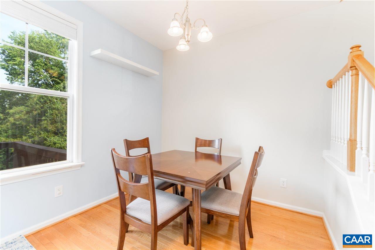 1313 Stoney Ridge Road Charlottesville, VA 22902 - Photo 17 of 38 a view of a dining room with furniture and a window