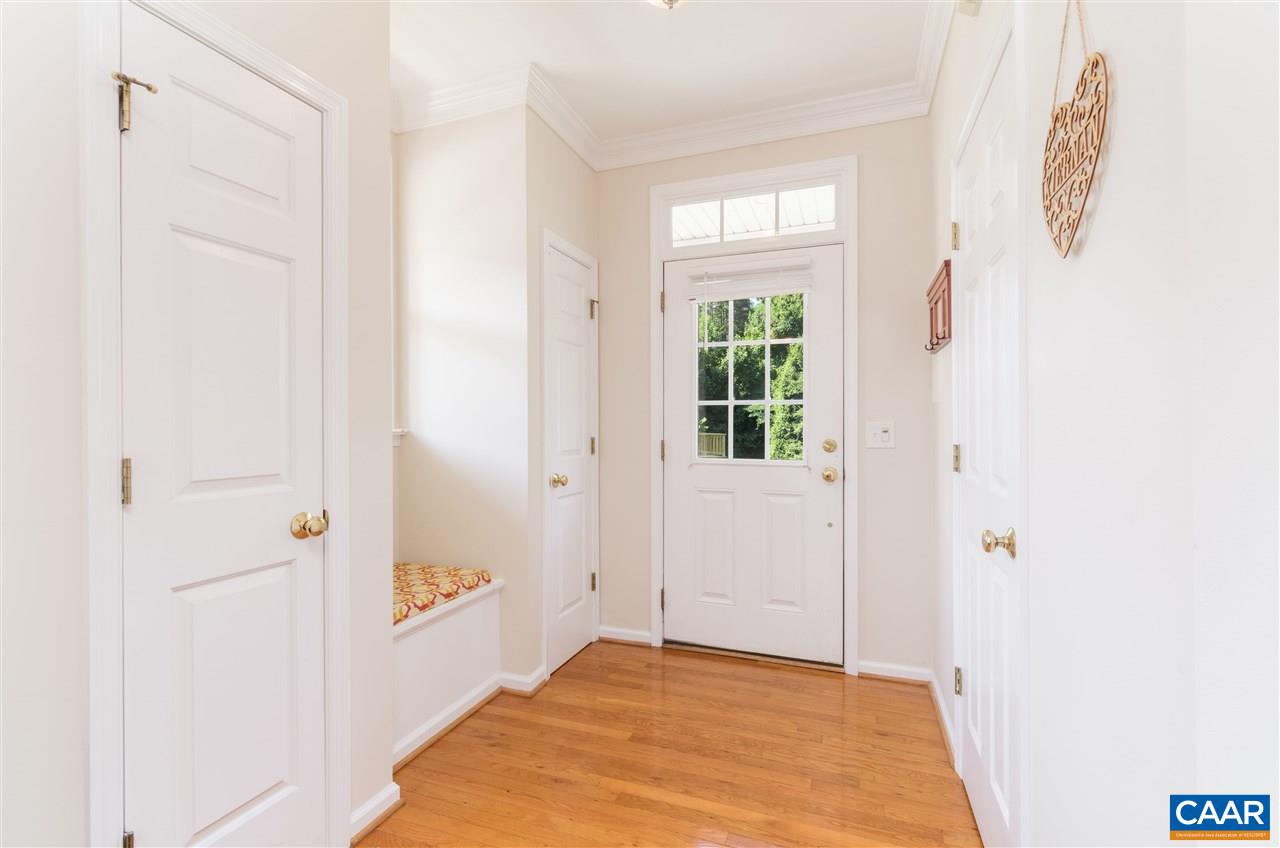 1313 Stoney Ridge Road Charlottesville, VA 22902 - Photo 6 of 38 a view of a bedroom with wooden floor and windows