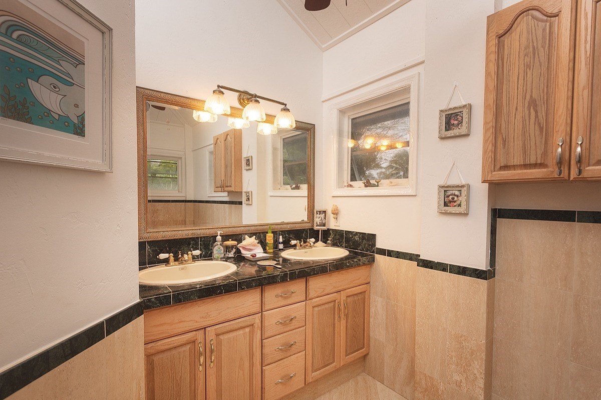 5851 Lokelani Road Kapaa, HI 96746 - Photo 11 of 21 a bathroom with a sink and a mirror