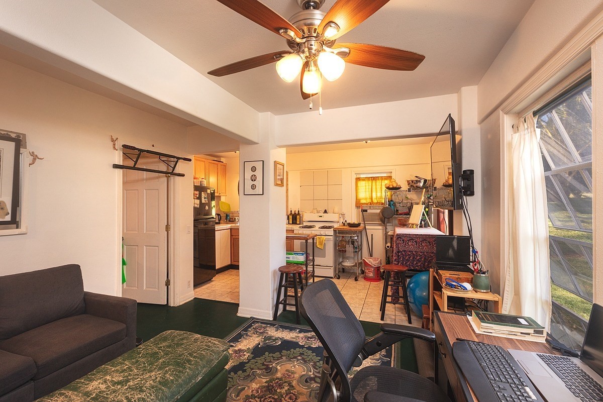 5851 Lokelani Road Kapaa, HI 96746 - Photo 15 of 21 a living room with furniture fireplace and a large window