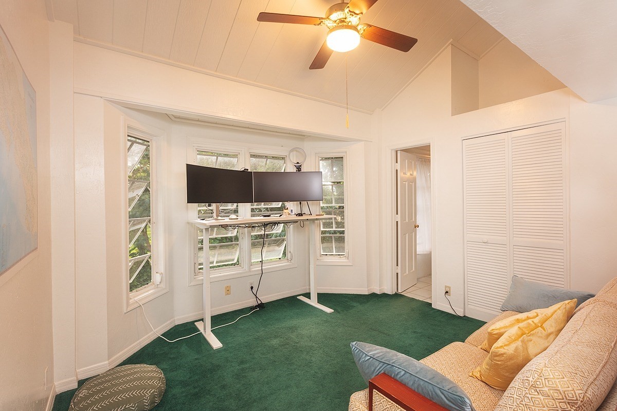 5851 Lokelani Road Kapaa, HI 96746 - Photo 6 of 21 a living room with furniture and a flat screen tv