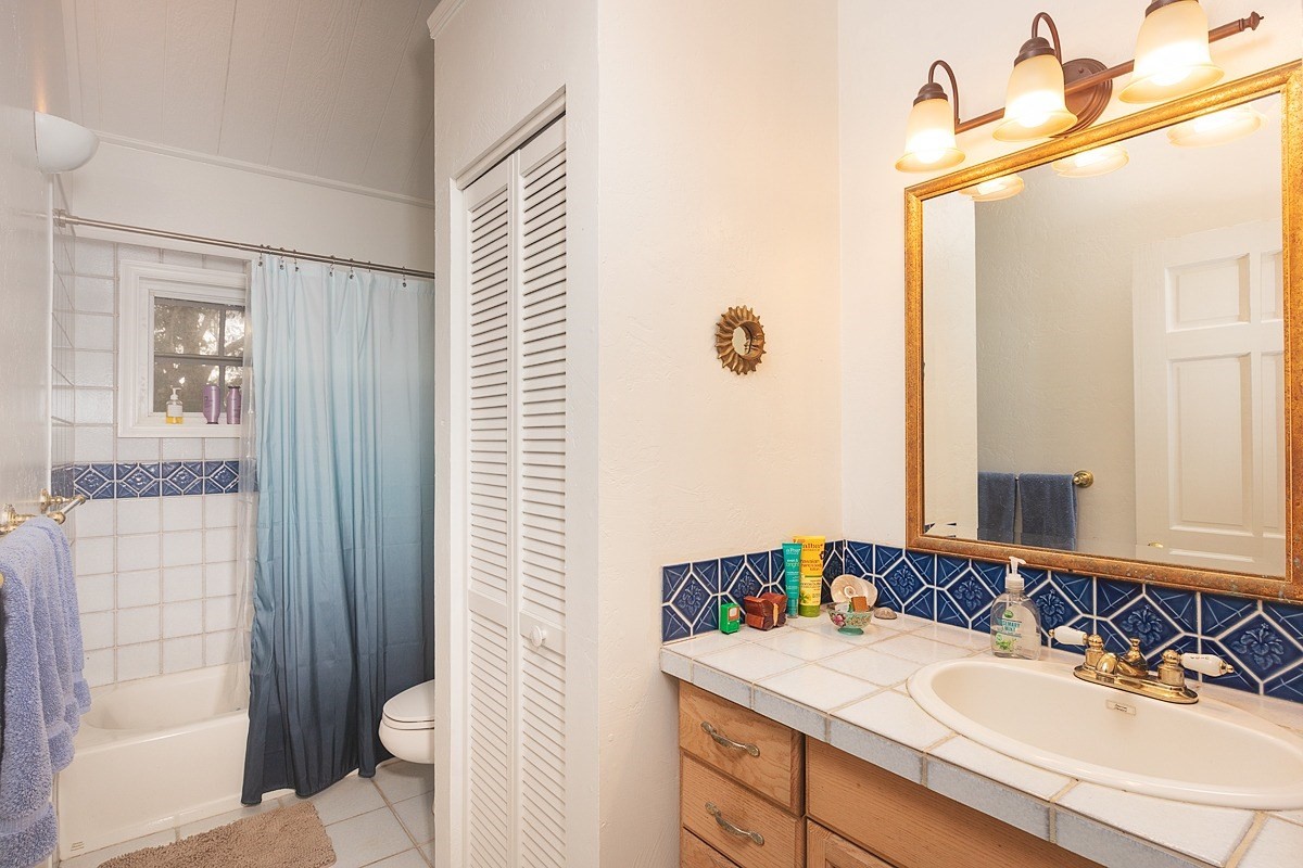 5851 Lokelani Road Kapaa, HI 96746 - Photo 9 of 21 a bathroom with a sink toilet and shower