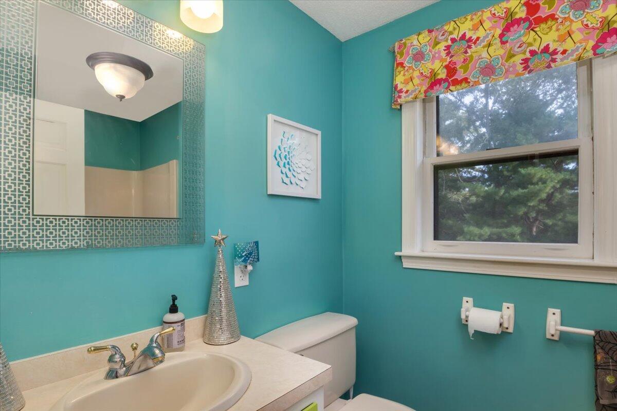 41 Service Road East Sandwich, MA 02537 - Photo 13 of 38 a bathroom with a sink mirror and a window