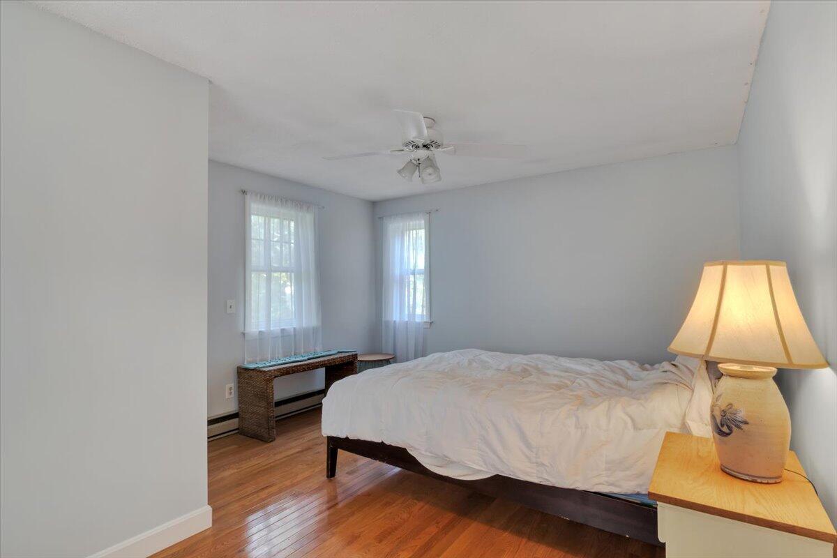 41 Service Road East Sandwich, MA 02537 - Photo 19 of 38 a bedroom with a bed and a window
