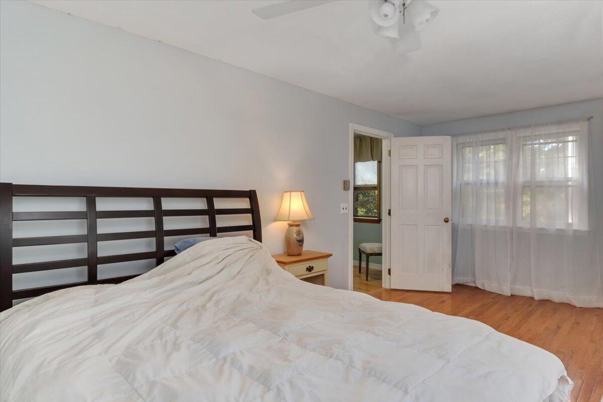 41 Service Road East Sandwich, MA 02537 - Photo 20 of 38 a bedroom with a bed and a lamp