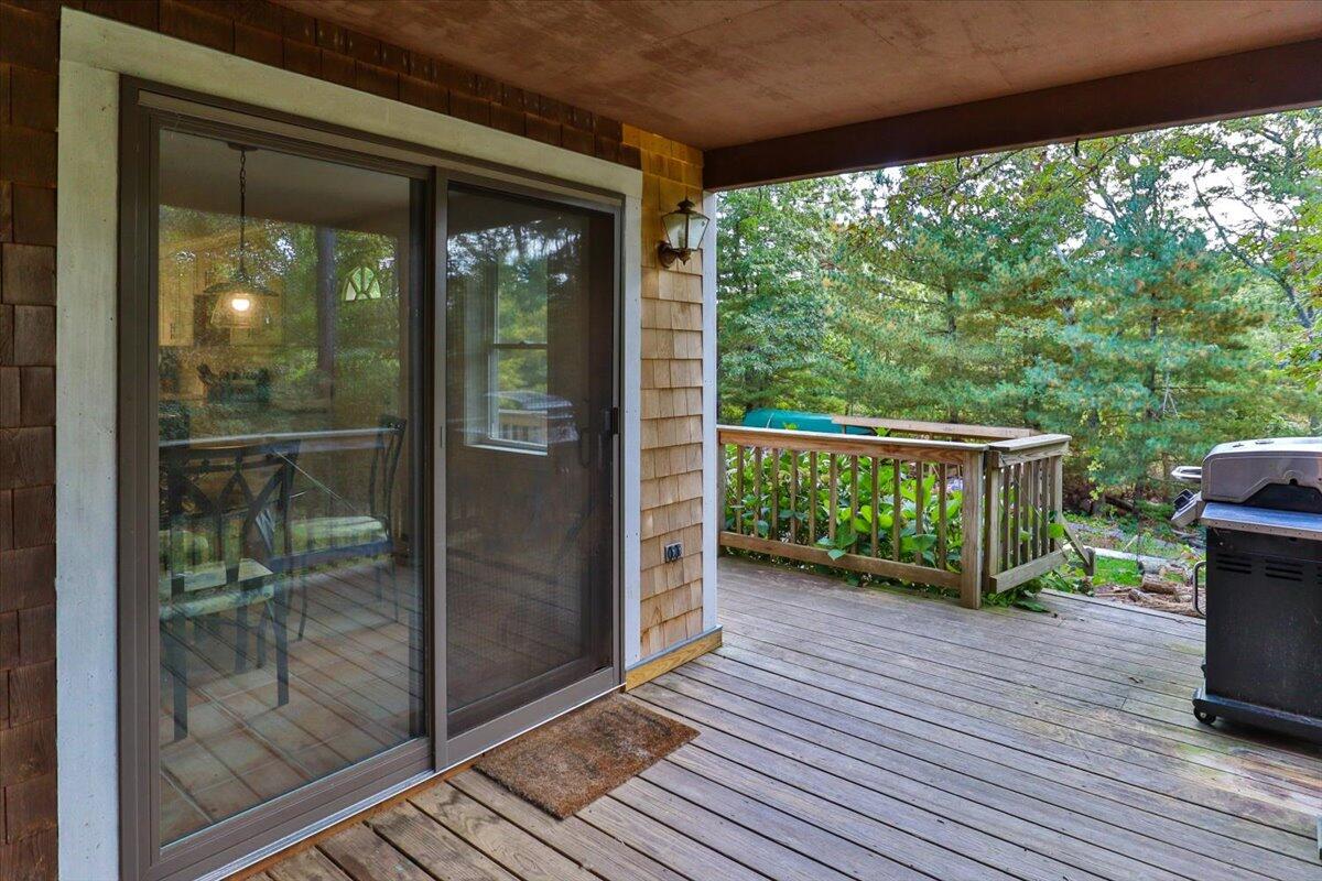 41 Service Road East Sandwich, MA 02537 - Photo 27 of 38 a view of a room with wooden floor and outdoor space