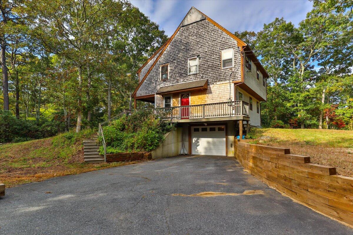 41 Service Road East Sandwich, MA 02537 - Photo 32 of 38 a front view of a house with a yard