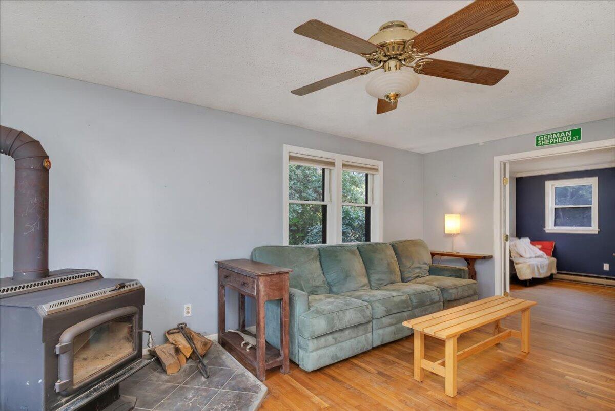 41 Service Road East Sandwich, MA 02537 - Photo 10 of 38 a living room with furniture and a fireplace