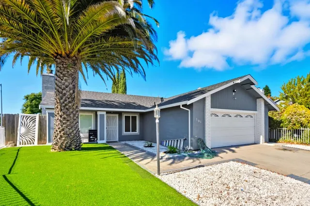 a front view of a house with garden