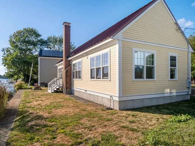 a kitchen with stainless steel appliances granite countertop a refrigerator sink and cabinets