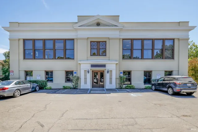 a view of a car parked in front of a building