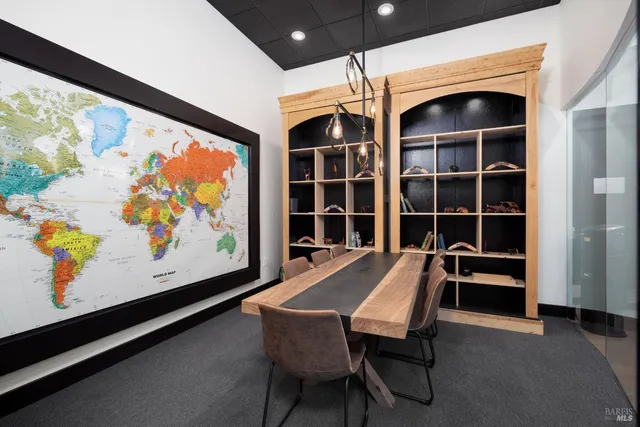 a view of a room with furniture and window