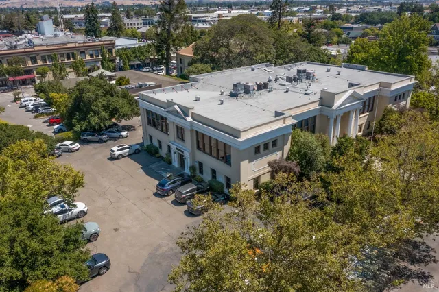 an aerial view of a house with a garden